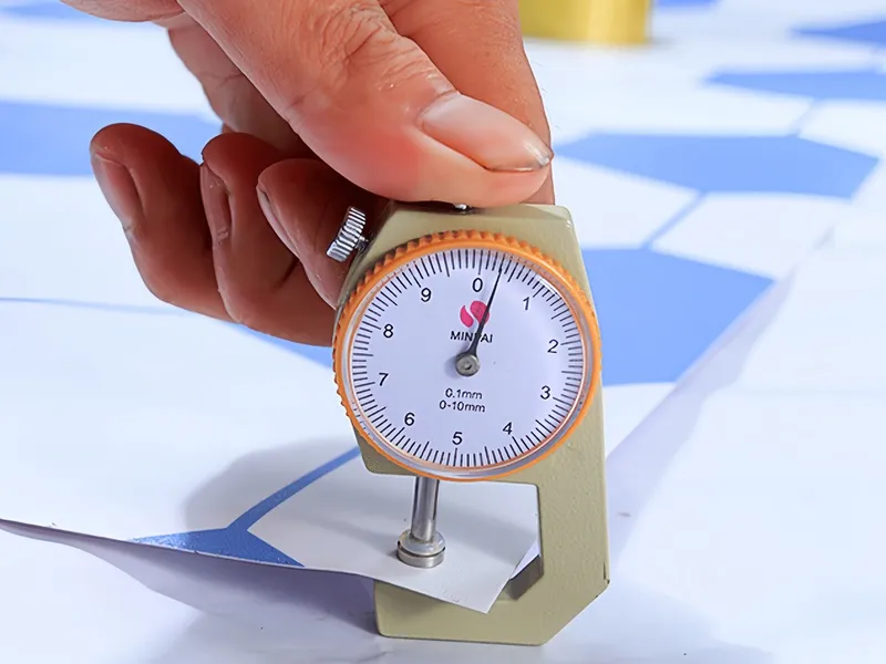 Applying cheap adhesive PVC film with a squeegee tool